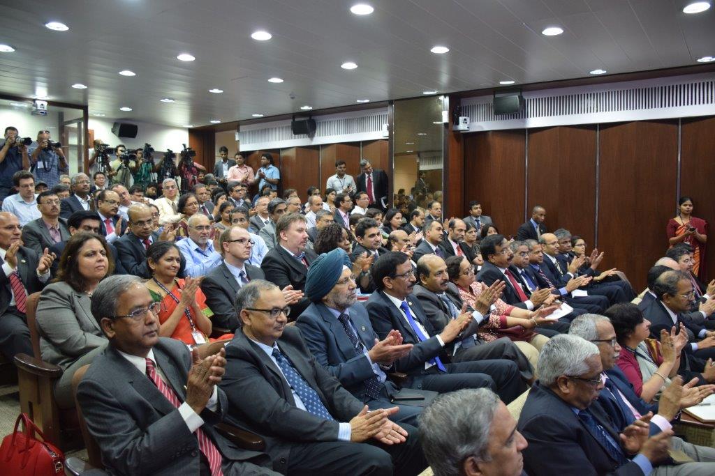 The audience applauding the distinguished guest speaker
